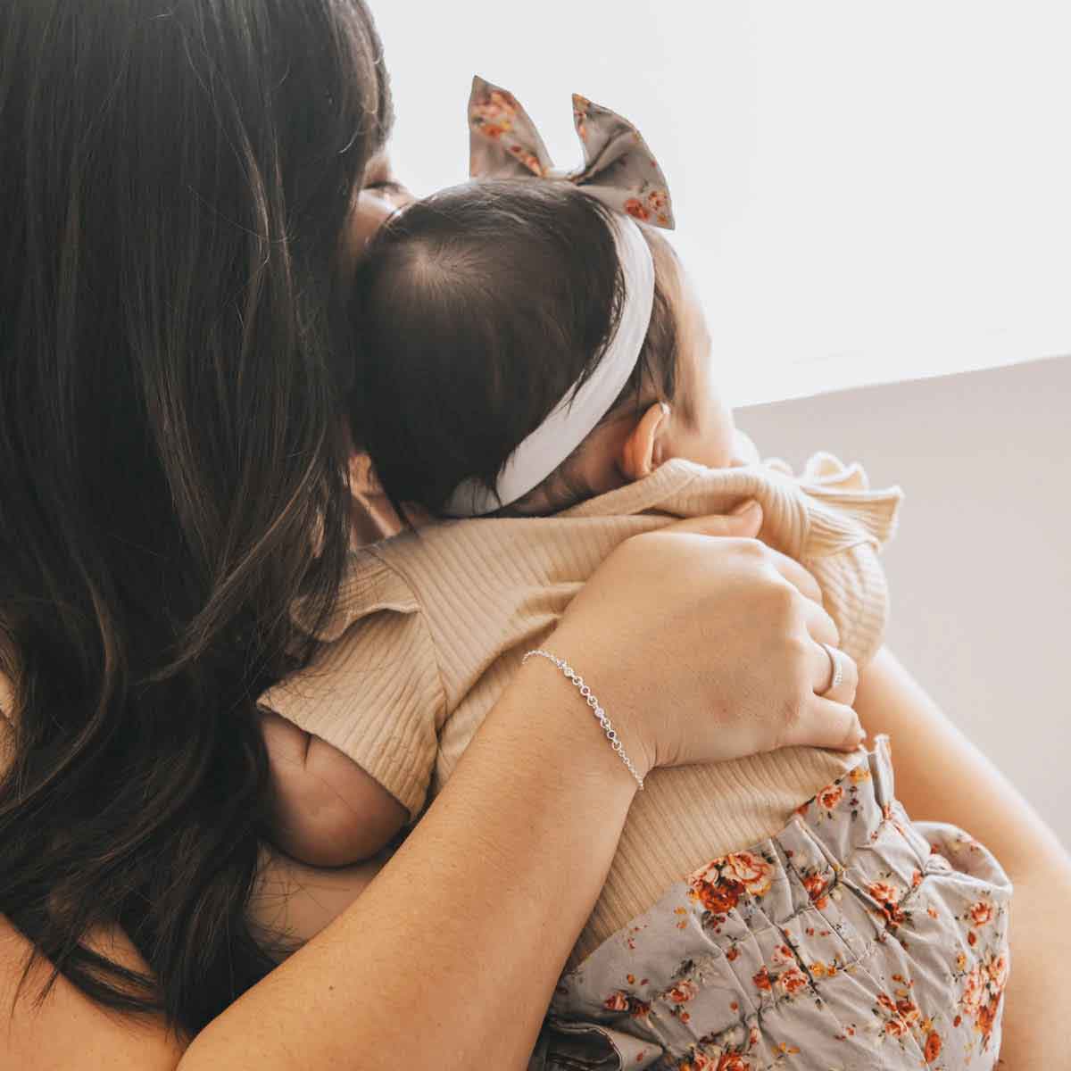 girl holding sterling silver Dainty Finespun Birthstone Bracelet - Small