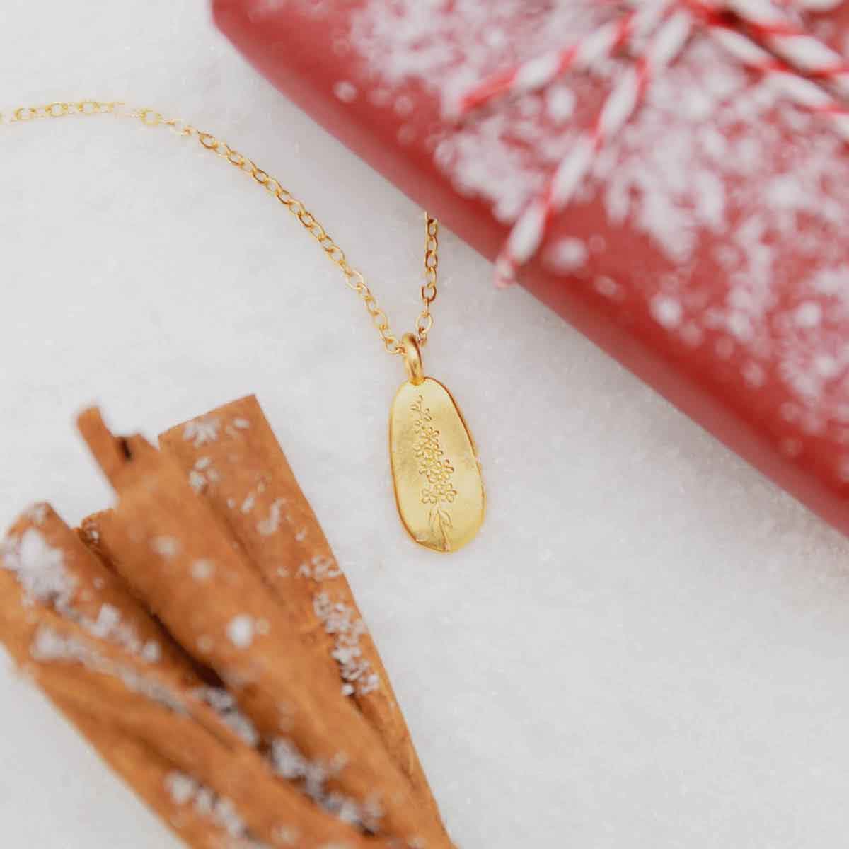 girl wearing a gold plated July