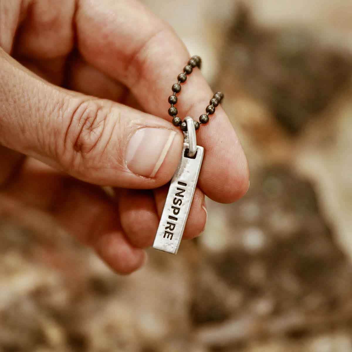 man wearing a sterling silver Kairos Necklace with personalization