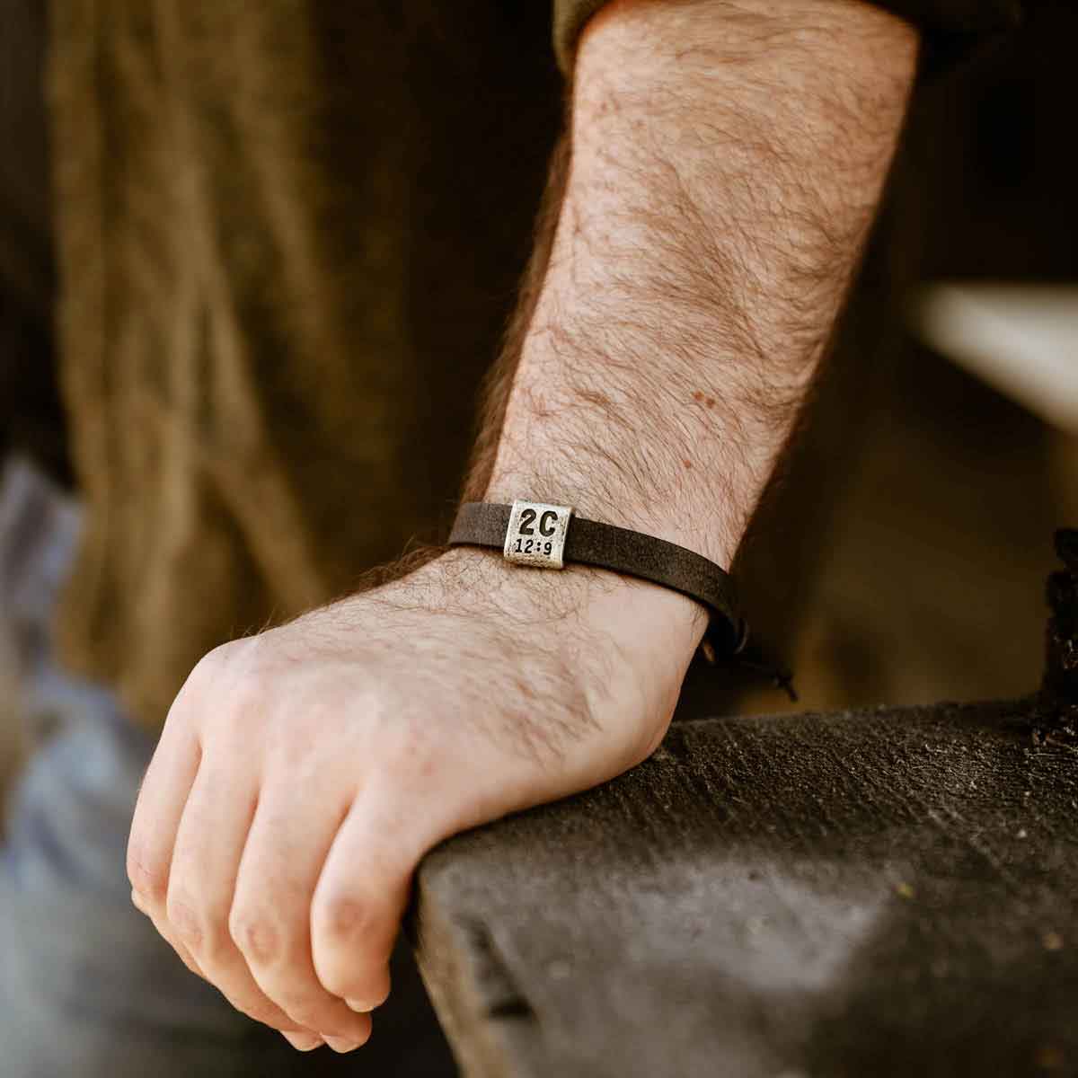 man wearing a black Equitable Leather Verse Bracelet