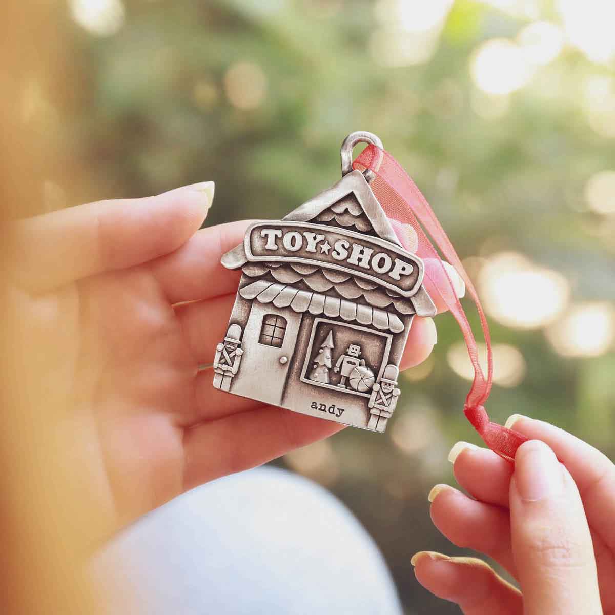 surrounded by fake snow and gift boxes