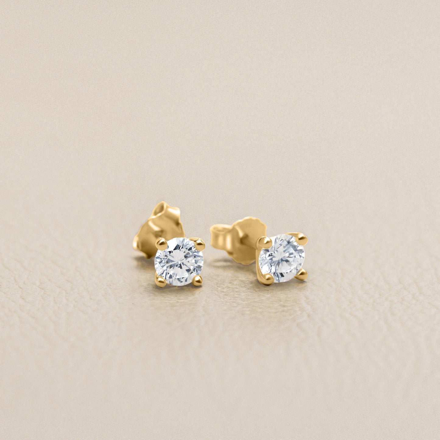 You are a Light Round Diamond Stud Earrings 0.5 ct (14K Solid Gold)