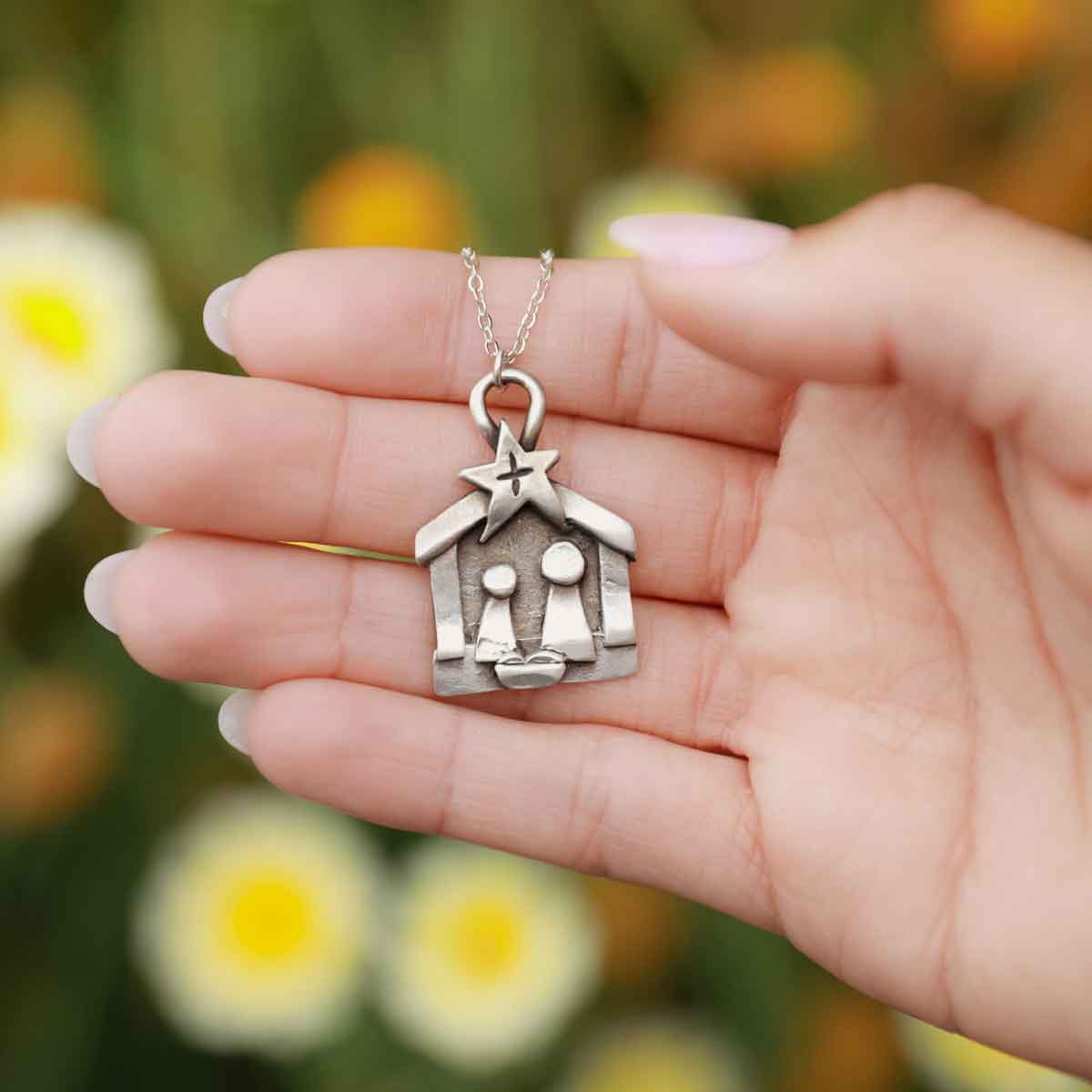 Girl wearing a Savior is Born Nativity Necklace