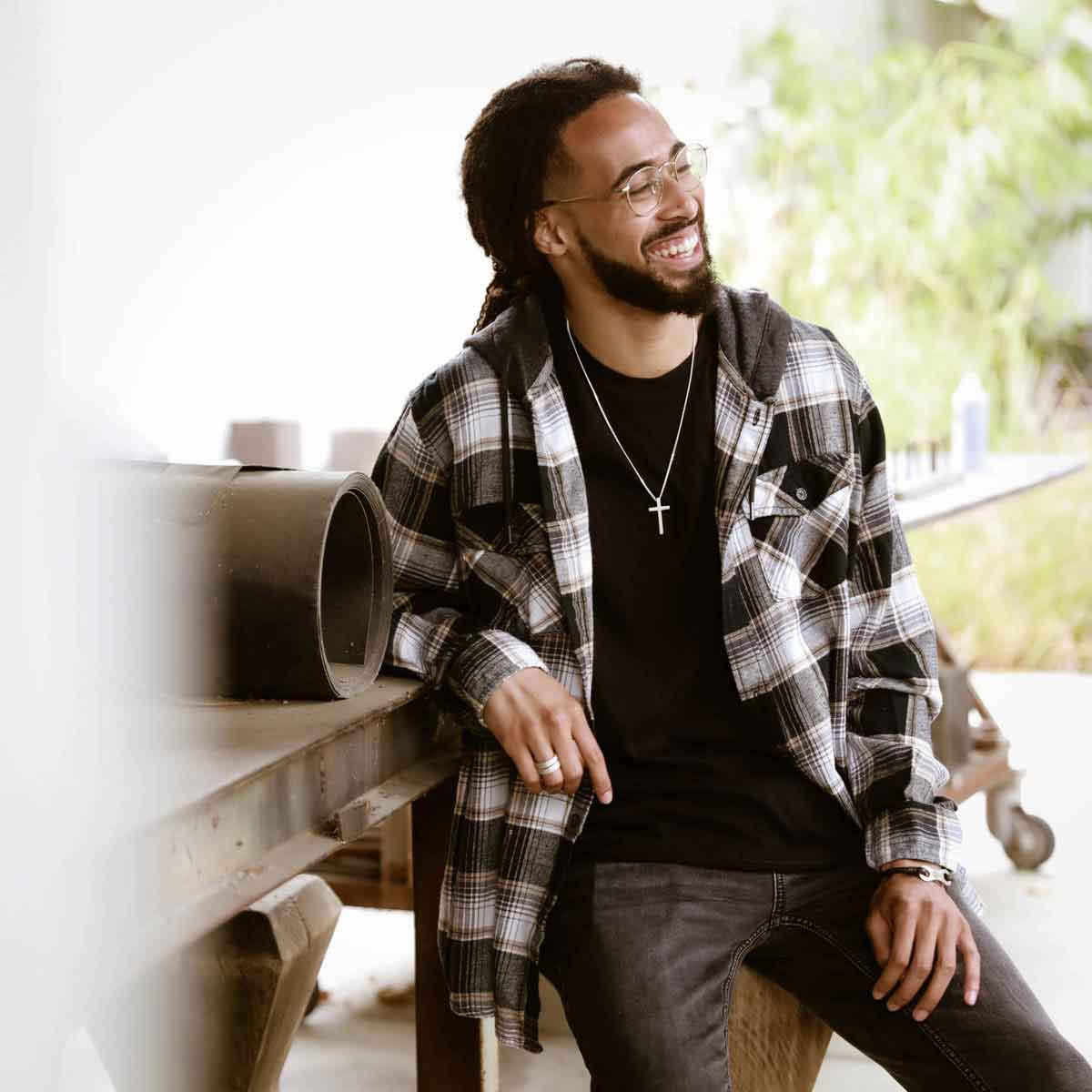 man wearing a sterling silver Beloved Cross necklace