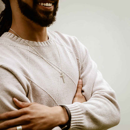 man wearing a sterling silver Beloved Cross necklace