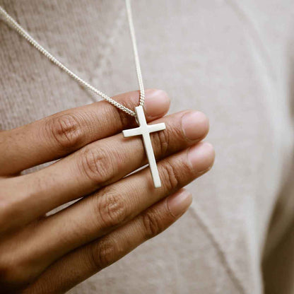 man wearing a sterling silver Beloved Cross necklace