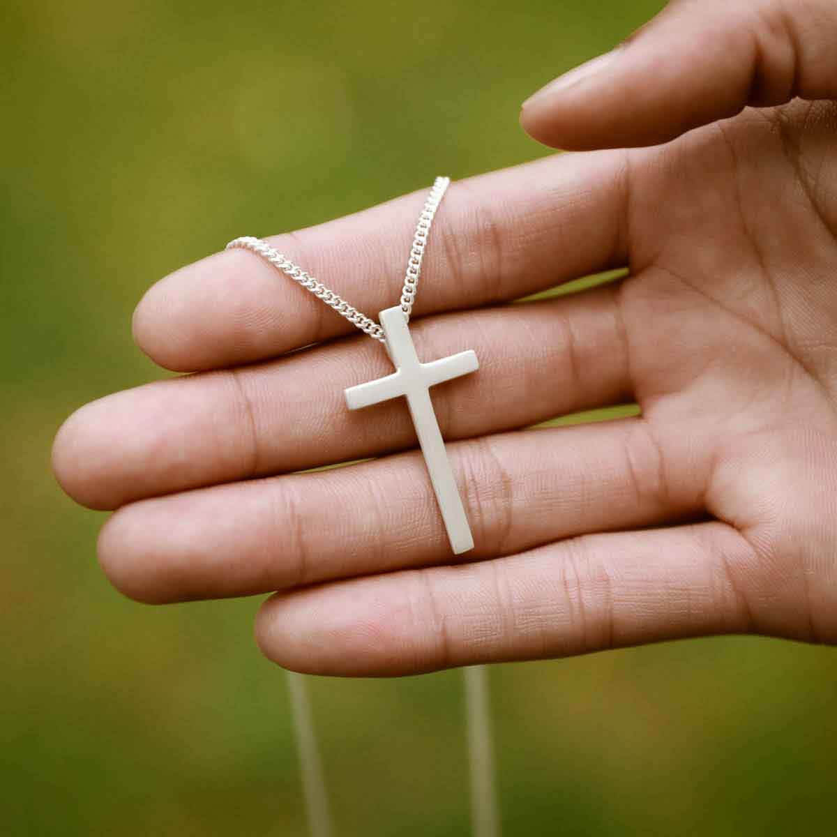 man wearing a sterling silver Beloved Cross necklace