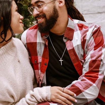 man wearing a sterling silver Beloved Cross necklace