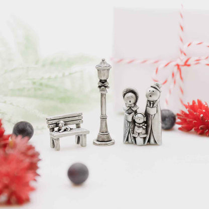 hand holding the lamppost from The Carolers Christmas Village Collection