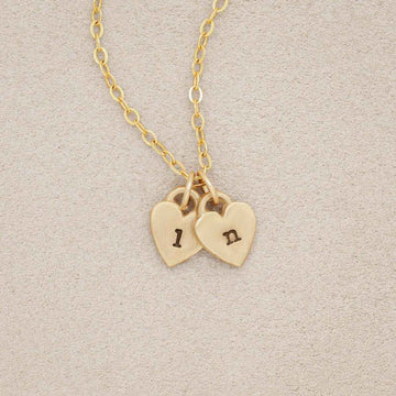 Cherished hearts initials necklace handcrafted in 10k yellow gold including two customizable charms