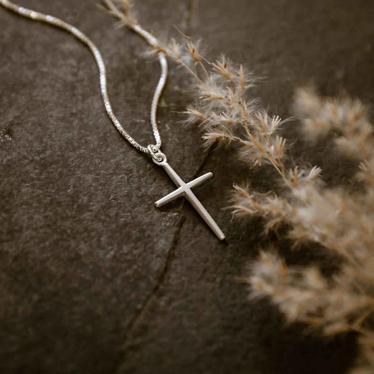 woman wearing a sterling silver Covenant of Love Cross necklace