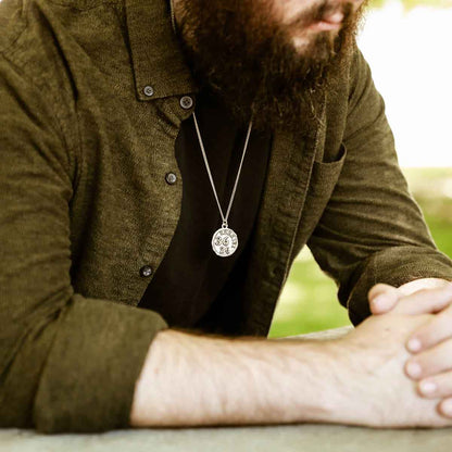 man wearing a Ezekiel 36:26 Coin Necklace