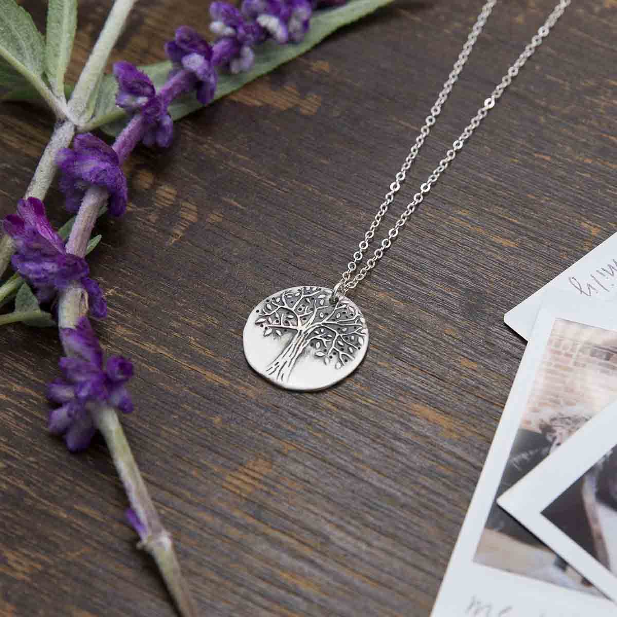 Family tree necklace handcrafted in sterling silver with a matte brushed finish and personalized with a quote or family name