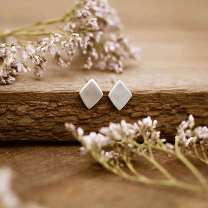 girl wearing a pair of Fly A Kite Stud Earrings