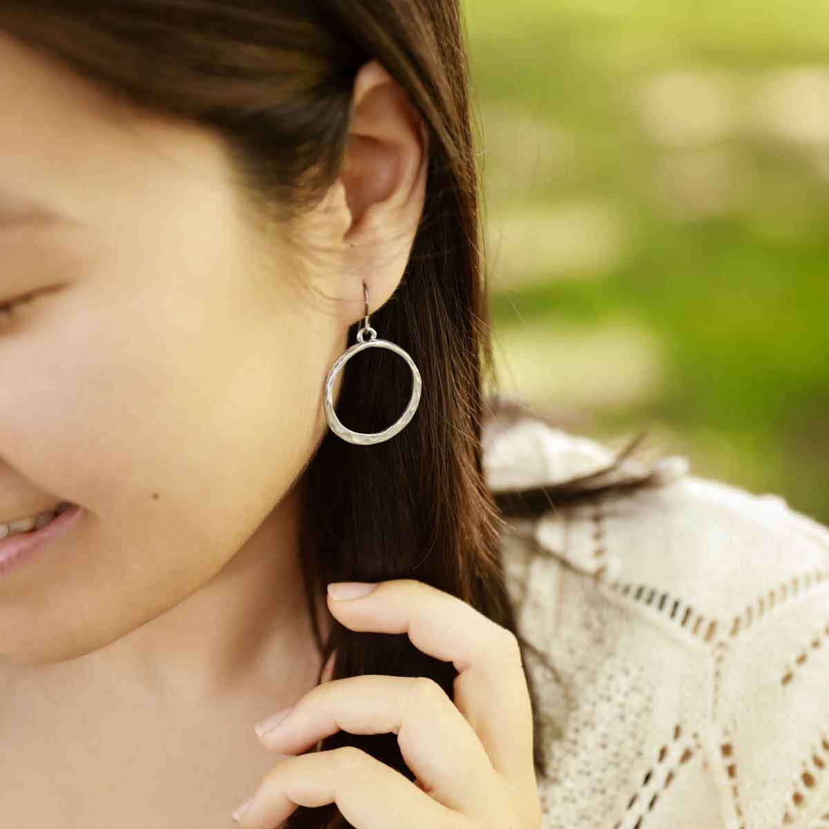 girl wearing pewter Hammered Hoop earrings