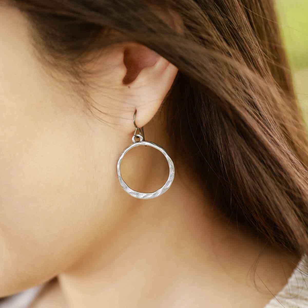 girl wearing pewter Hammered Hoop earrings