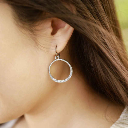 girl wearing pewter Hammered Hoop earrings