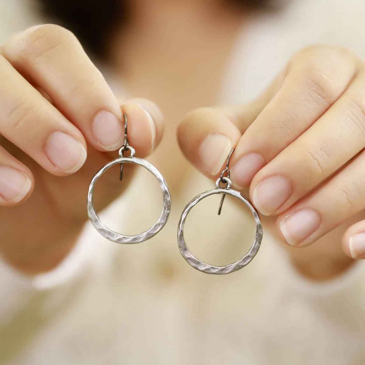 girl wearing pewter Hammered Hoop earrings