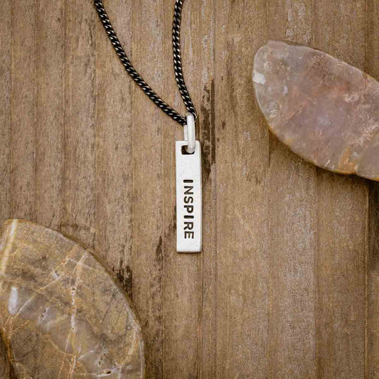 sterling silver Kairos Necklace with personalization, on wood background