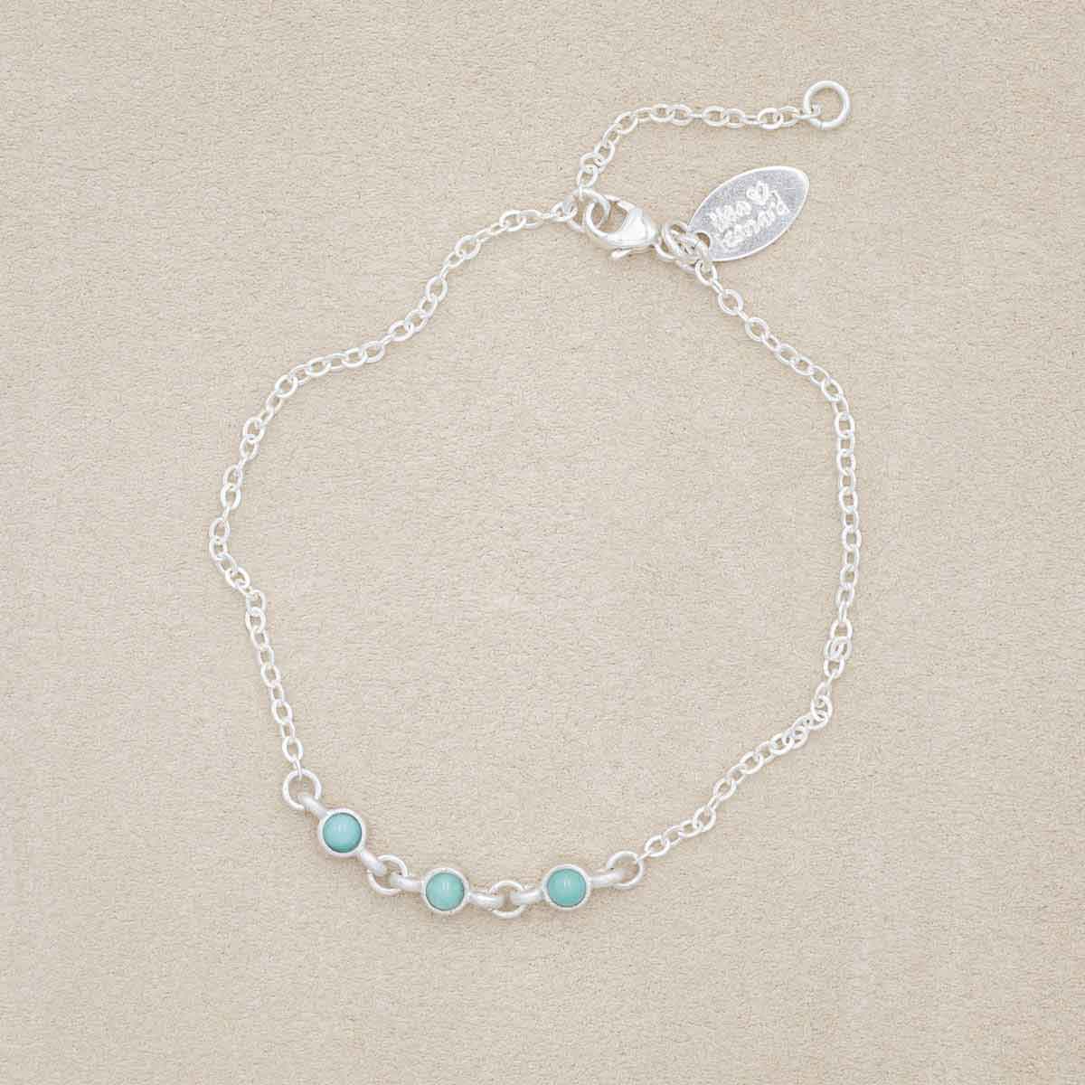 sterling silver Lighthearted Turquoise Bracelet on a beige background