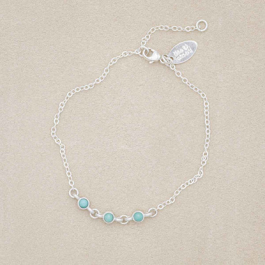sterling silver Lighthearted Turquoise Bracelet on a beige background