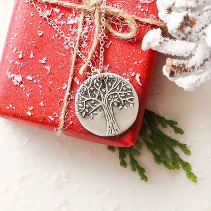 Family tree necklace handcrafted in sterling silver with a matte brushed finish and personalized with a quote or family name