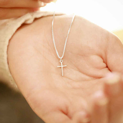 woman wearing a sterling silver Love & Accepted Cross necklace