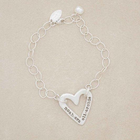 Handcrafted sterling silver molded heart bracelet with a freshwater pearl