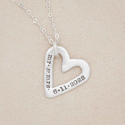 sterling silver molded heart necklace on geode background