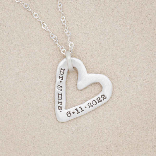 sterling silver molded heart necklace on geode background