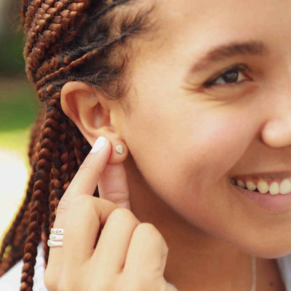 girl wearing sterling silver raindrop stud earrings