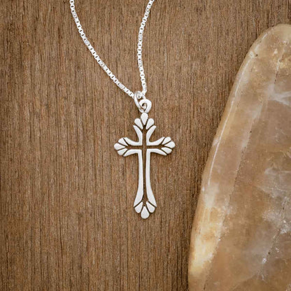sterling silver Resurrection Cross Necklace, on wood background
