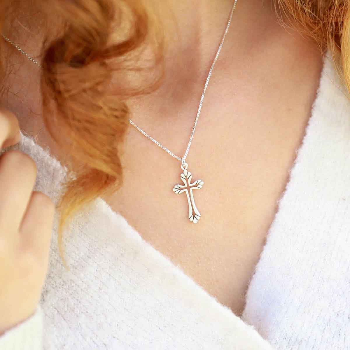 woman wearing a sterling silver Resurrection Cross Necklace