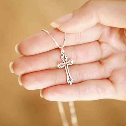 woman wearing a sterling silver Resurrection Cross Necklace