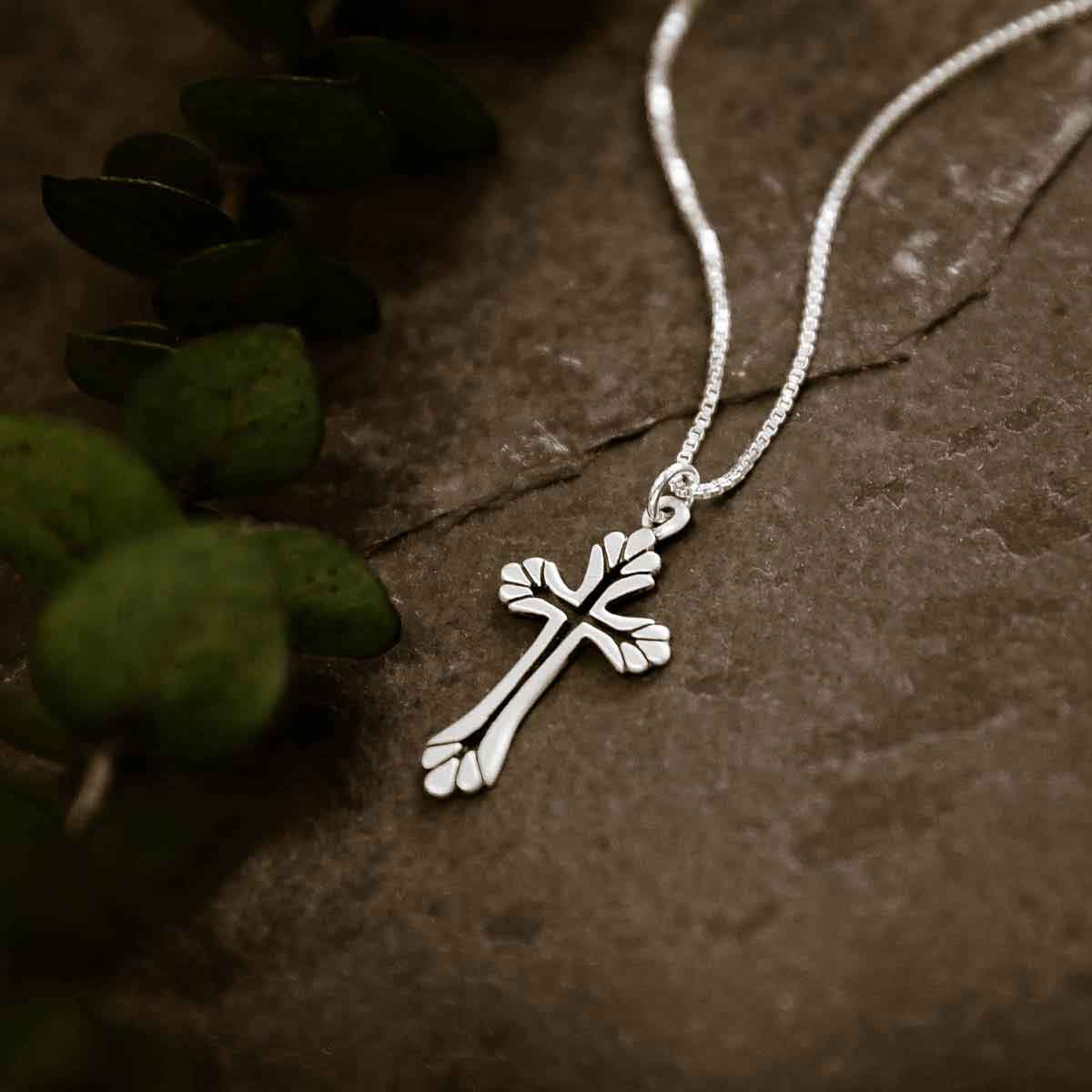 woman wearing a sterling silver Resurrection Cross Necklace