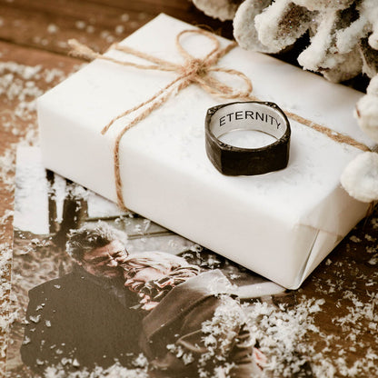 Man wearing Strong + True ring handcrafted in sterling silver and sandblasted to a matte black finish and personalized with a meaningful name